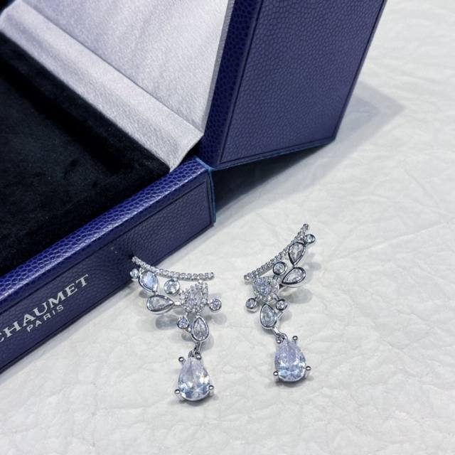 Chaumet's Coronation of Love collection features tassel drop earrings with a sel