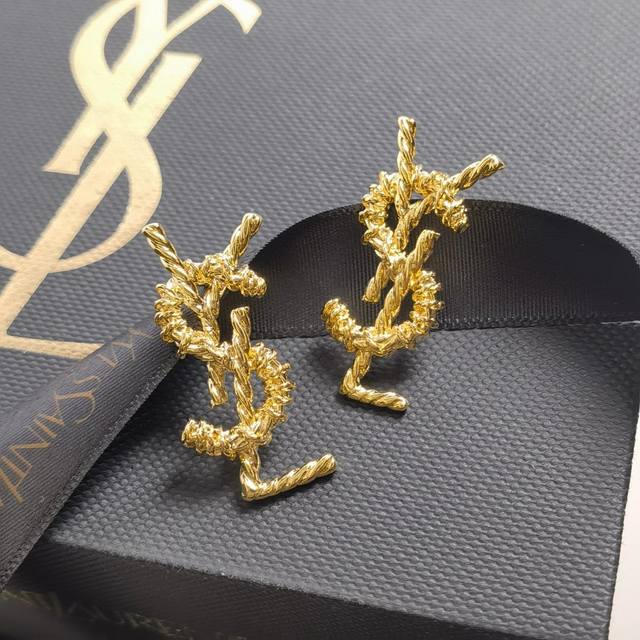 Yves Saint Laurent gold stud earrings are timeless in their beauty. A classic fr