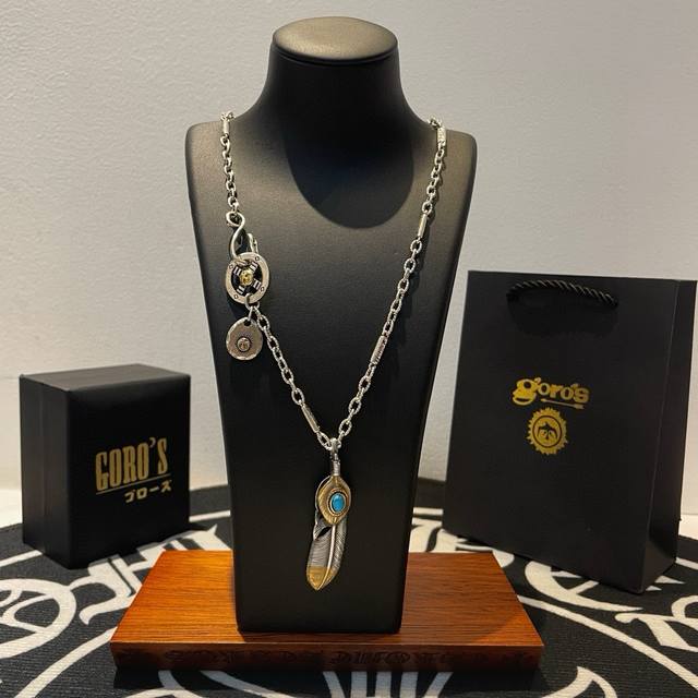 New arrival: Goro's Takahashi Goro's gold-finished turquoise feather pendant, T