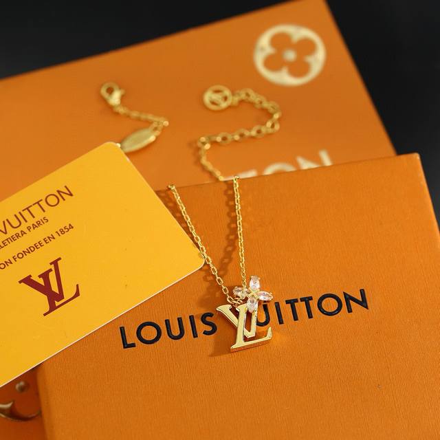 This exquisitely crafted Louis Vuitton letter necklace, crafted with exquisite