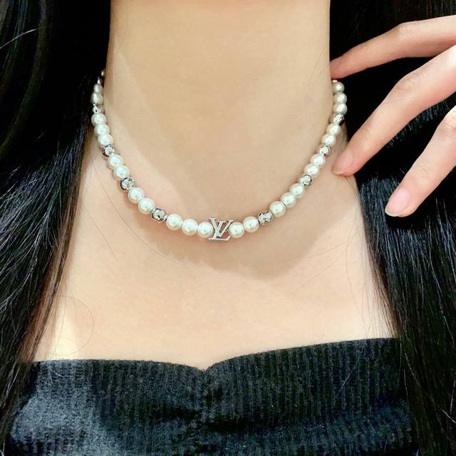 Louis Vuitton's unique design uses classic Lv graphics and looks great! This nec