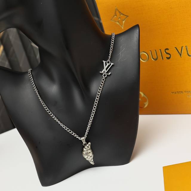 Lv Croissant Medium Pendant Mo3127 This Lv Croissant Medium pendant, designed by