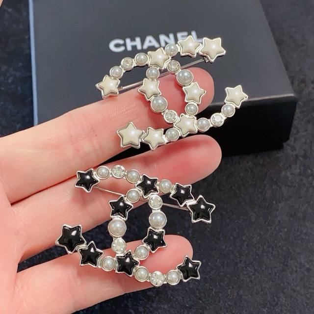 Chanel's new five-pointed star pearl brooch is a truly feminine accessory. Women