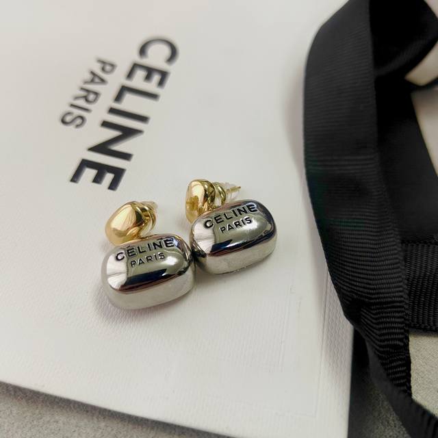 Celine Celine's hand-brushed double-bead letter earrings are stylish, simple, an