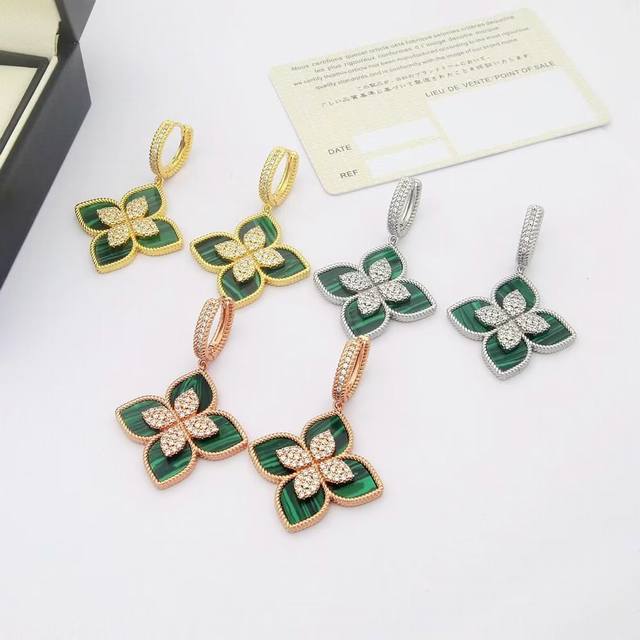 Roberto Coin Four-Leaf Flower Earrings. Made of brass and plated with 18K gold,