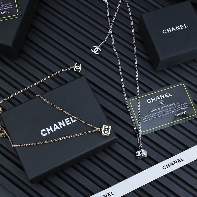 Chanel's popular small sugar cube necklace is a must-have! The black lettering i