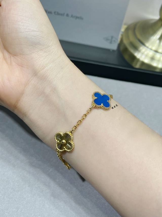 V gold, Vca blue agate, spaced-out four-leaf clover bracelet. Cleef & Arpels' fo