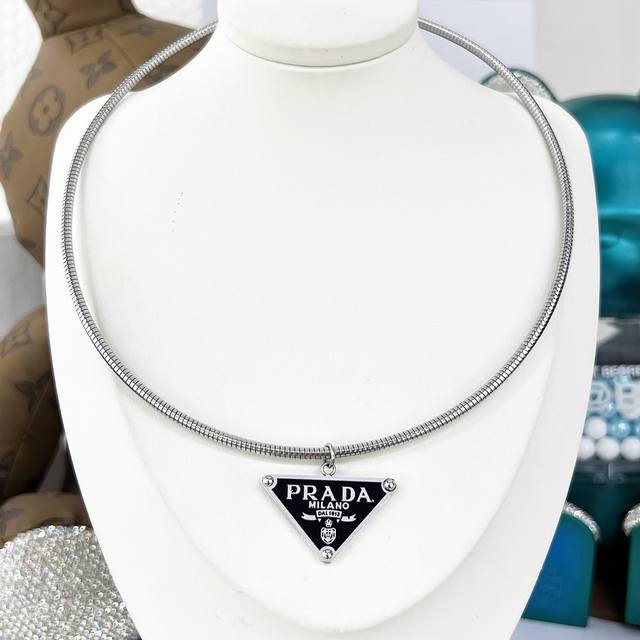 Silver Prada Triangle Choker - A new and popular item. The choker features a pen