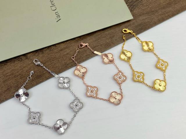 Van Cleef & Arpels laser-cut four-leaf clover multi-faceted diamond pendant brac