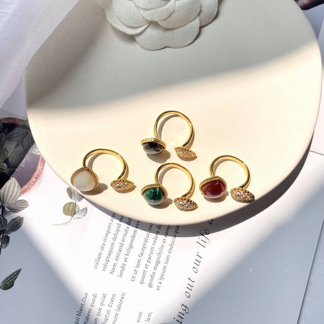 Boucheron's new teardrop-shaped agate and mother-of-pearl ring in red, green, bl