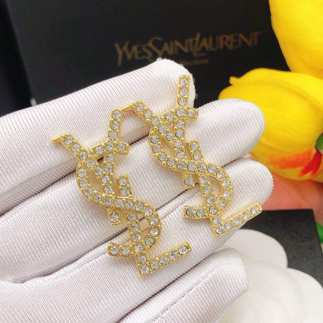 Item No. Yed0011 Saint Laurent earrings with diamond setting, gold color.