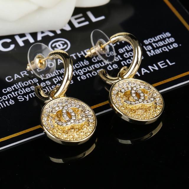 Chanel's new gradient drip earrings, now available in boutiques. Double C stud e