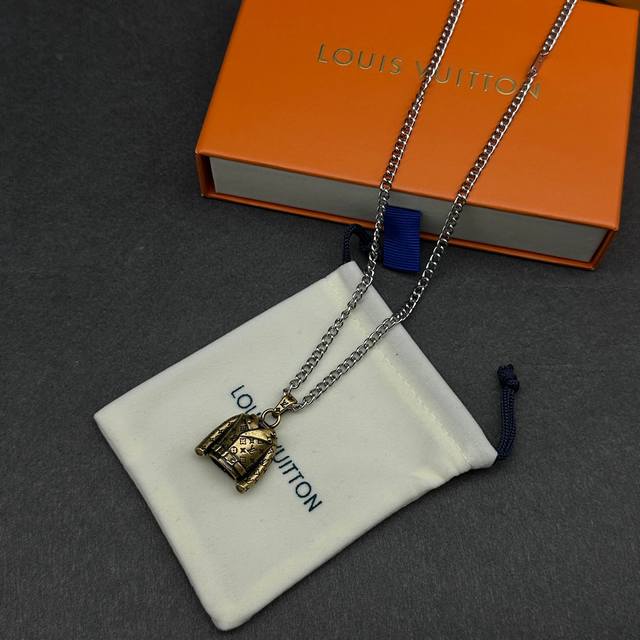 LV Jacket Charm (Ddd) This LV Jacket charm features a whimsical and exquisite de