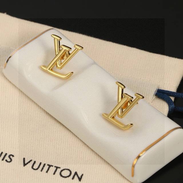 Louis Vuitton gold letter stud earrings bring a fashionable and fun visual appea
