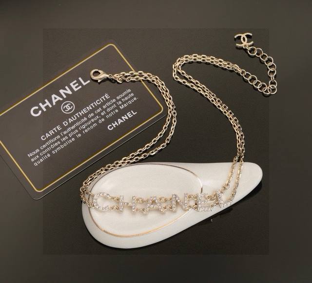 Chanel double-chain necklace and bracelet, classic and versatile, showcasing fem