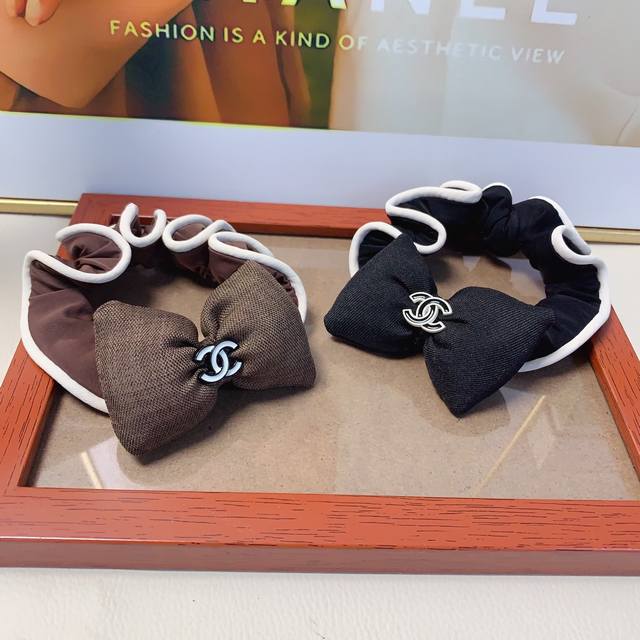 Chanel Mini Hair Tie (Ddd) A delicate and versatile everyday hair tie with a bow