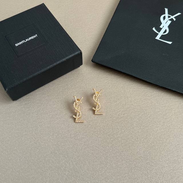 Saint Laurent earrings with a superb metallic texture, made of original brass, e