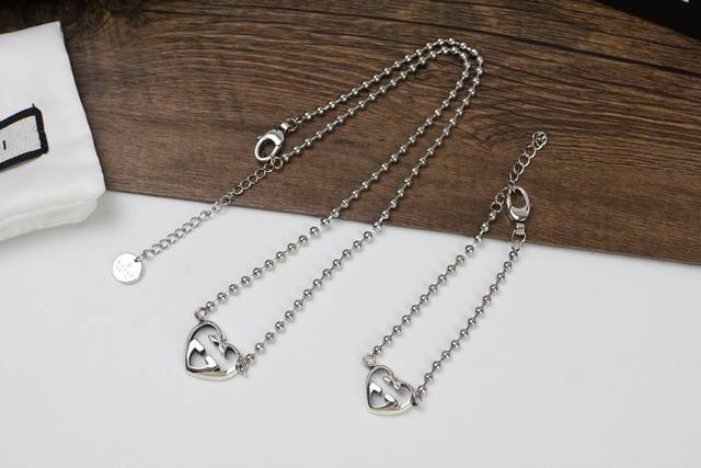 Gucci double G heart interlocking necklace and bracelet. The classic double G lo