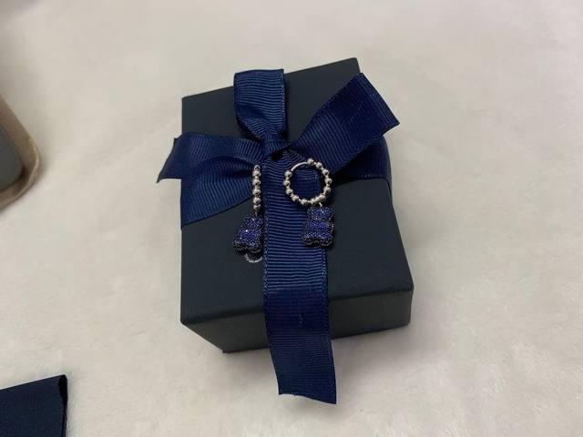 A batch of Monaco Baby Babayummy Bear hoop earrings, cool blue, reversible desig