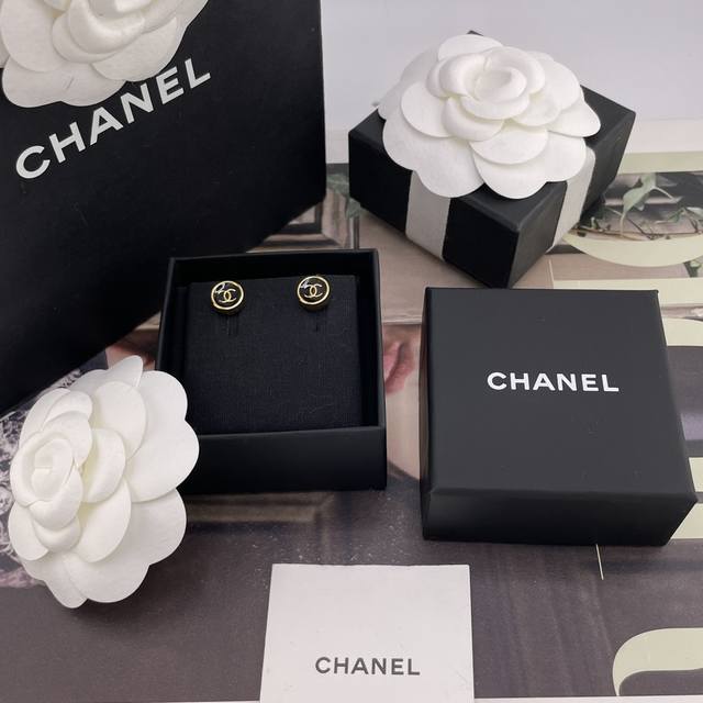 Our Z 4200 small round black stud earrings with gold trim are a hot new arrival