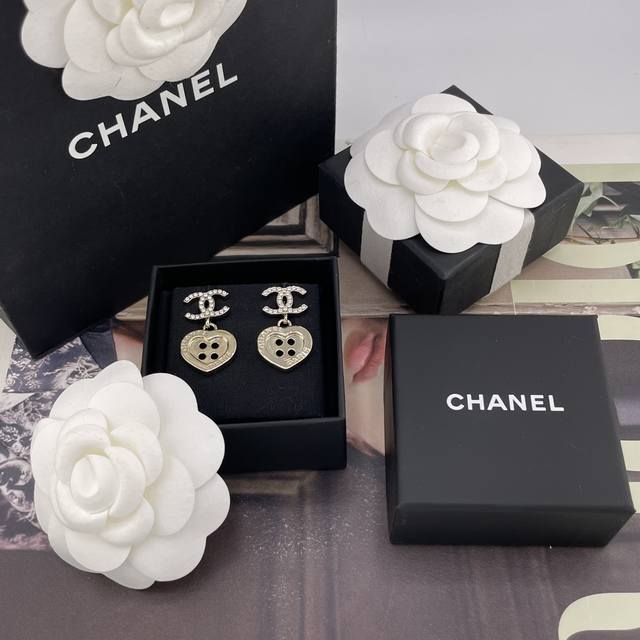 We offer the Chanel Double C Drop Button Heart Earrings Z 5200, in stock, first