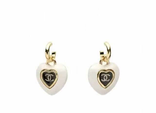 Chanel Heart-Shaped Acrylic Earrings (Ddd) These black and white earrings featur