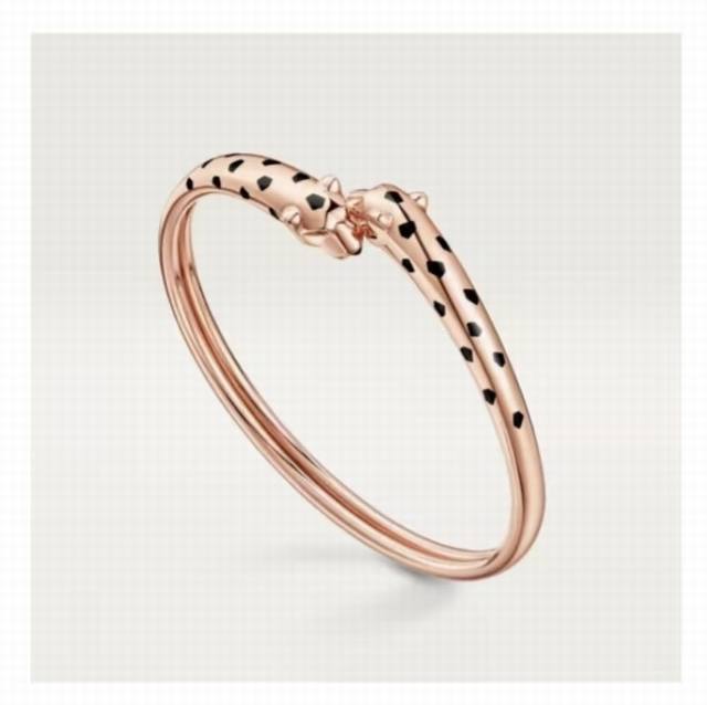 Fine-grained, bright gold double-headed panther bracelet with bold black speckle