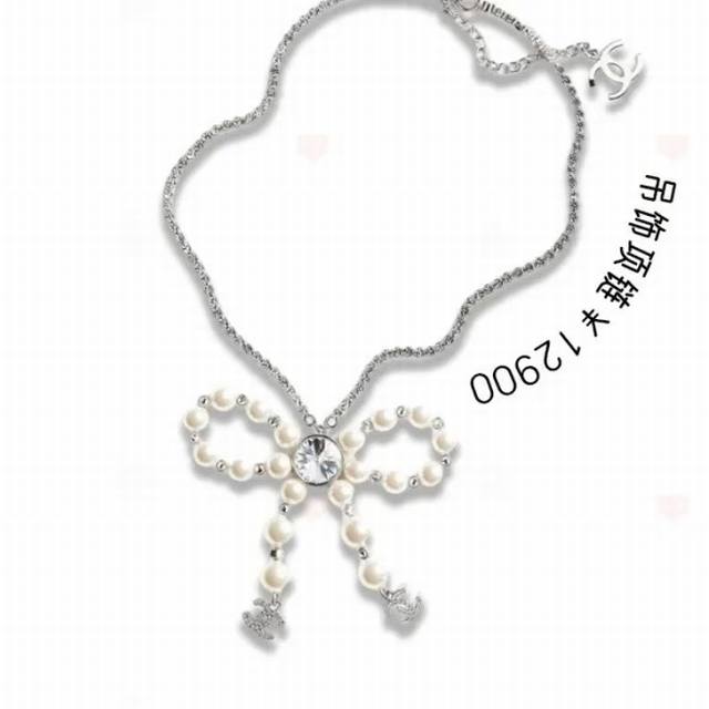 Chanel Bow Pearl Rhinestone Necklace. Featuring a bow, rhinestones, and pearls,