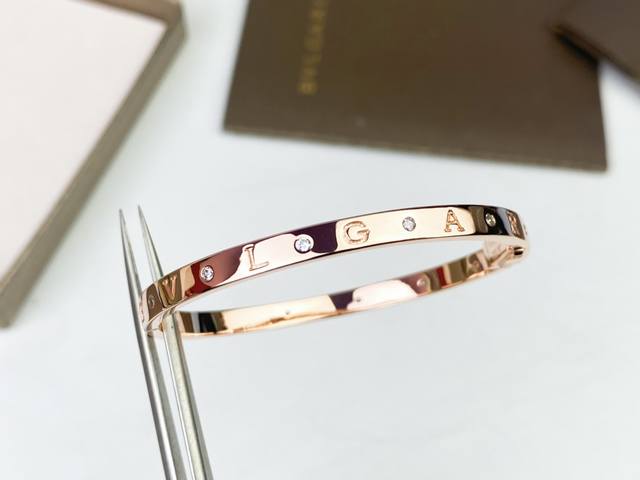 Bvlgari monogram bracelet with diamond accents. Featuring the iconic monogram lo