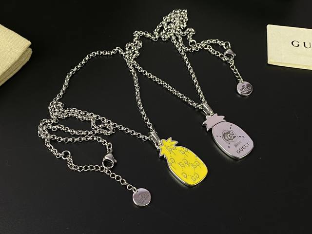 Gucci skull and yellow pineapple necklace. This Gucci necklace is truly beautifu
