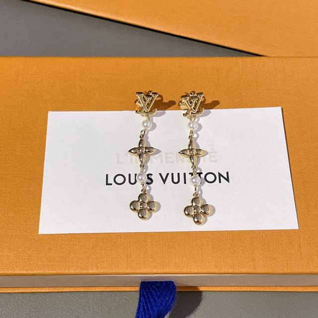 Exquisitely crafted Louis Vuitton pearl stud earrings. These LV earrings feature