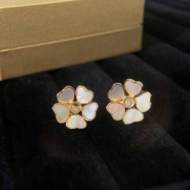 Chopard Hapipi Y Hearts Flowers earrings feature Chopard's iconic heart shape, w