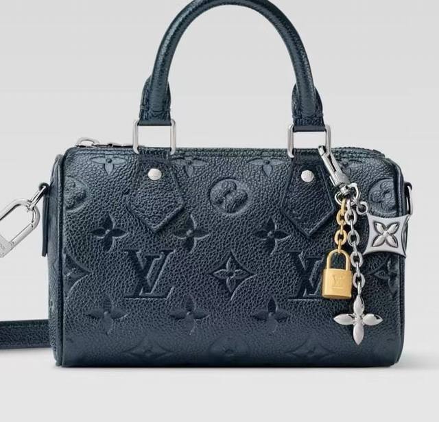 LV keychain bag charm/chain. The LV Spring bag is adorned with the brand's iconi