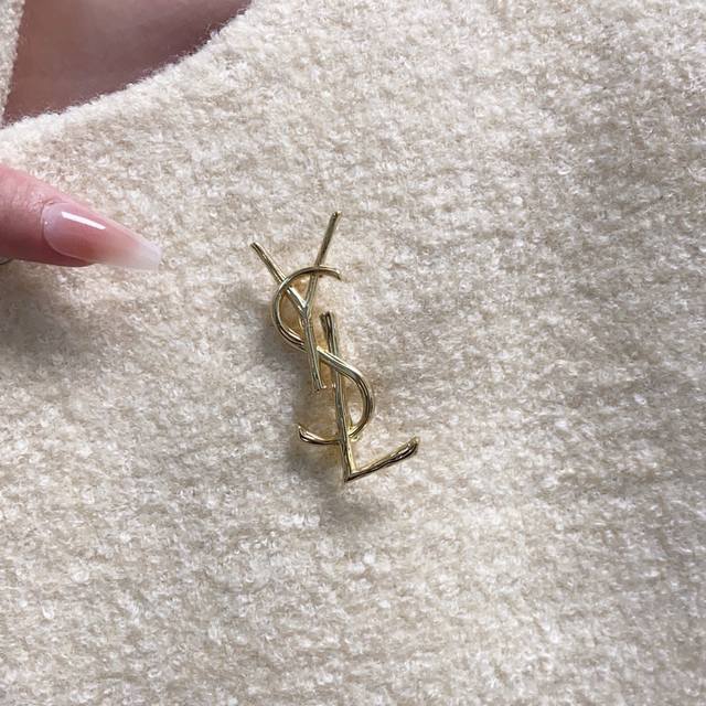 YSL Saint Laurent's new vintage wood grain brooch is the perfect accessory for w