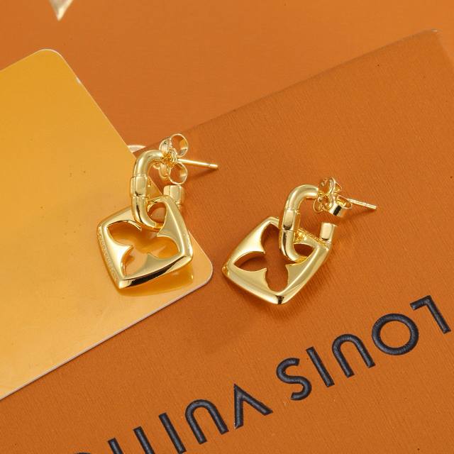 Louis Vuitton gold stud earrings bring a fashionable and interesting visual appe