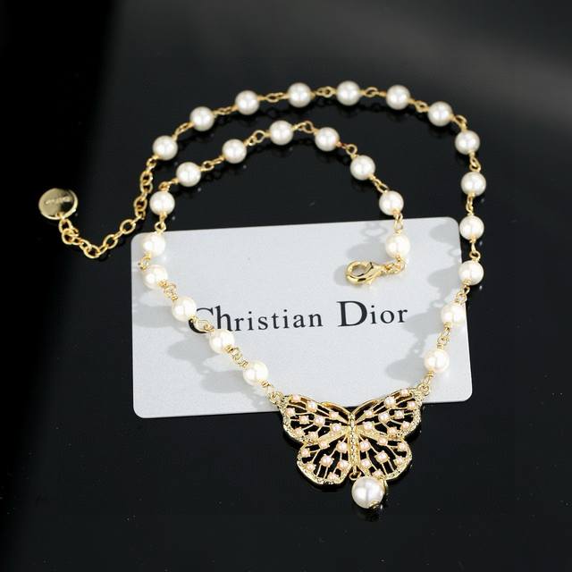 Dior Cd Bow Pearl Necklace. The simple design is undeniably stylish. The perfect