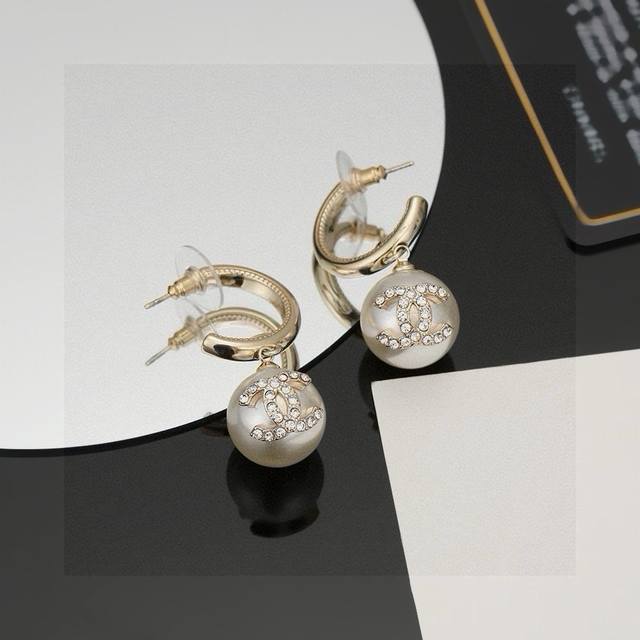 Chanel Pearl Stud Earrings - A fashionable and stylish piece from Chanel's early