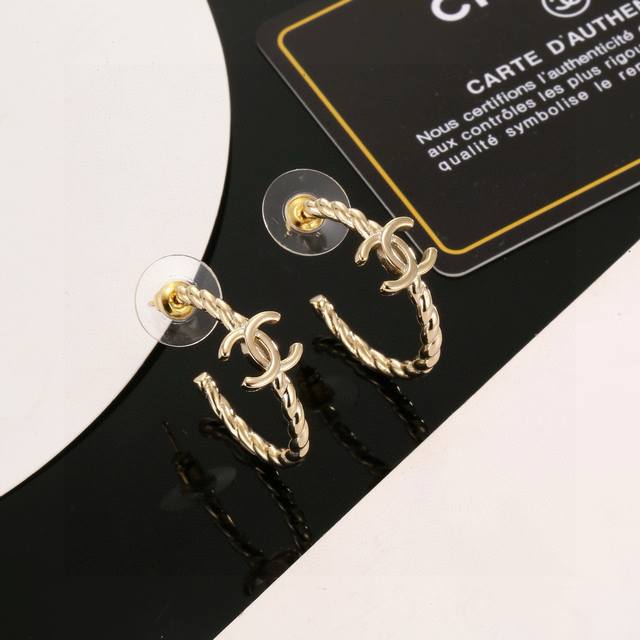 Chanel classic half-circle gold double C stud earrings. These are versatile and