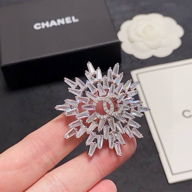 This new Chanel brooch features a snowflake-shaped design and is fully rhineston