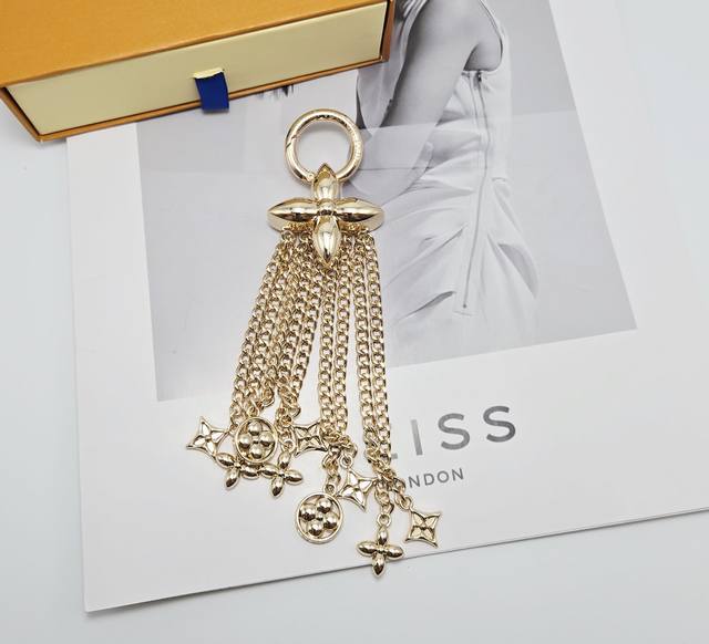 The Midnight Pearl Chain bag keychain reinterprets brand elements with a gothic