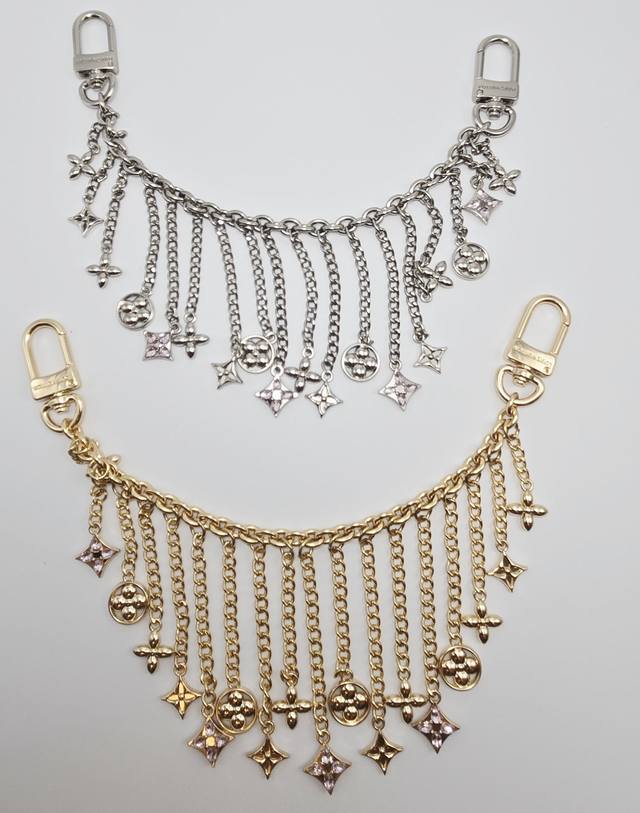 Midnight Pearl Chain bag charm, a two-tone design, reinterprets brand elements w