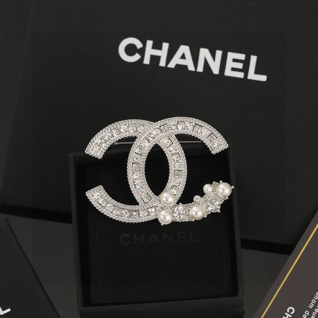 Chanel's newest double C brooch is here! A classic design, this bestseller is ma