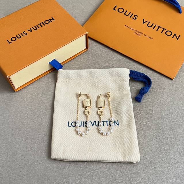 Original Louis Vuitton earrings, made with the same materials as those in boutiq