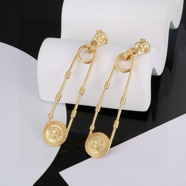 Versace Medusa safety pin earrings are an unmissable accessory that completely t