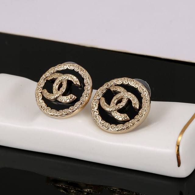 Chanel classic black round double C stud earrings. These are versatile and styli