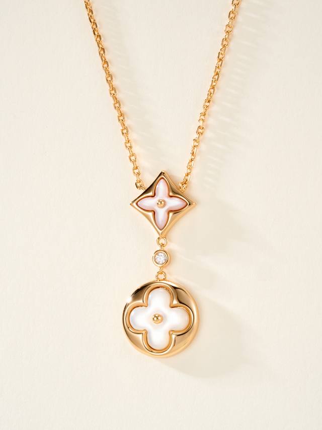Color Blossom necklace pays homage to the Monogram floral pattern. Star and Sun