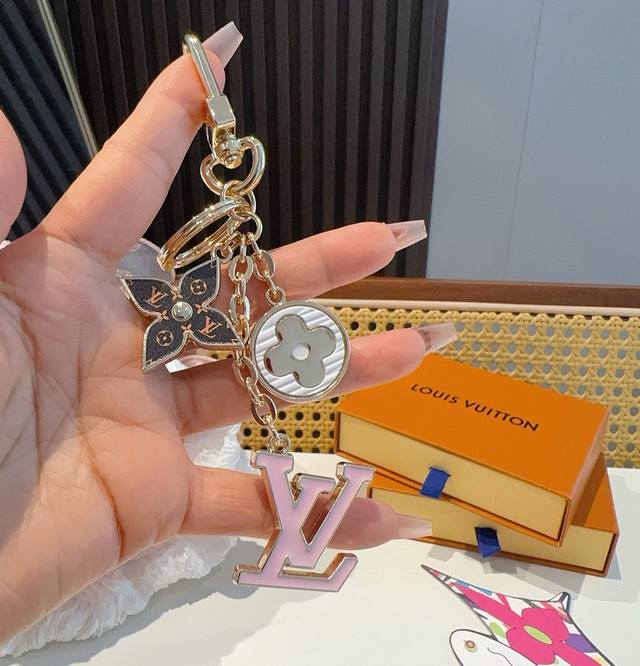 LV Keychain Bag Charm by Spring Street Chain. This bag charm transforms classic