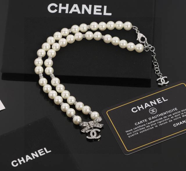 New Chanel 100th Anniversary Edition Bow Pearl Necklace/Collarbone Chain. Exquis