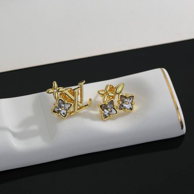 Louis Vuitton earrings bring a fashionable and fun visual appeal. The bright cut