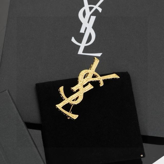 YSL Saint Laurent Brooch, original brass material. Yves Saint Laurent, founded i